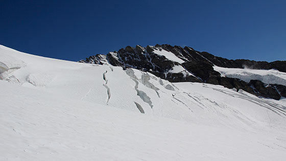 The first crevasses appear in the distance